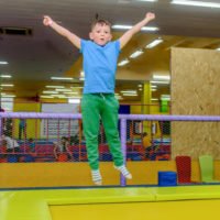 Child jumping on an indoor trampoline