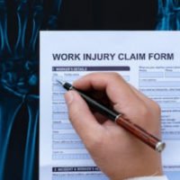 person signing a work injury claim form