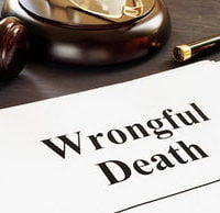 Paper on a desk that says "wrongful death"