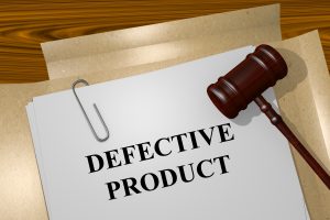 paper and files that say "defective product"