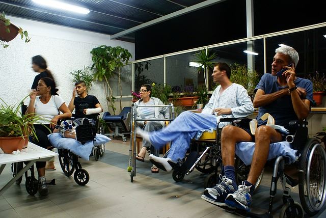 a group of people sitting in wheelchairs