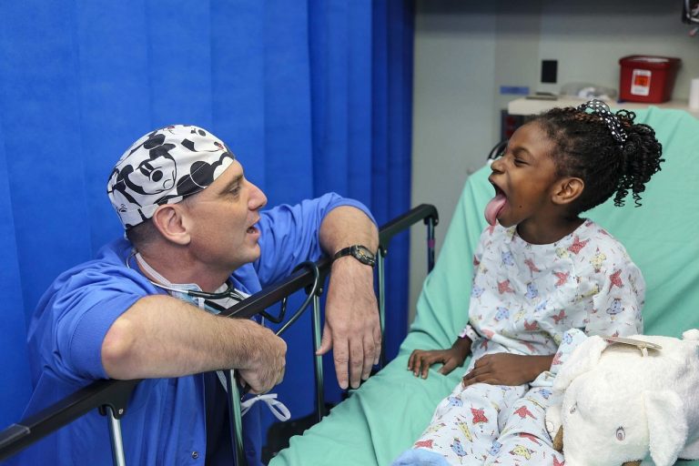 a doctor attending to a kid