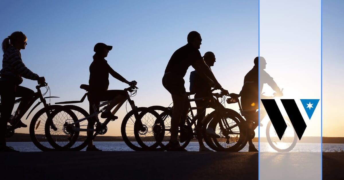 a group of people riding bikes