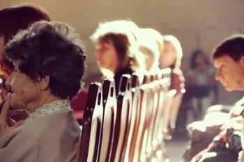 people sitting in an auditorium 