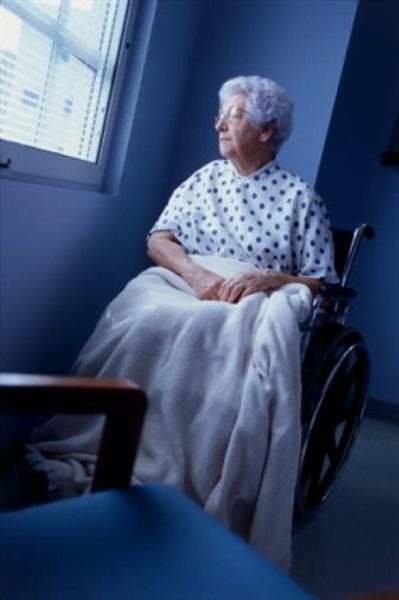 Elderly woman staring out the window