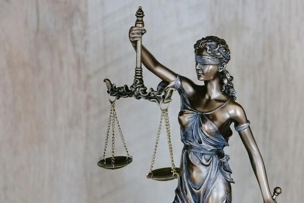 Lady Justice holding the scales of justice.