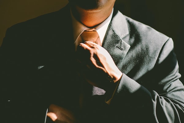 One of the best Chicago wrongful death attorneys adjusting their tie.