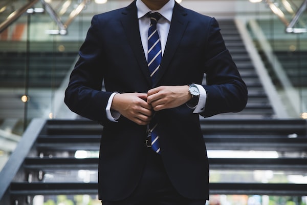 A Chicago slip and fall accident lawyer adjusting the button on their jacket