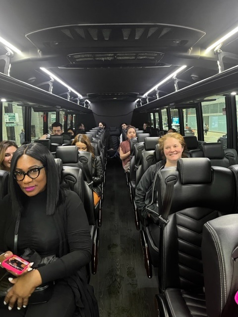 a group of people sitting in a bus