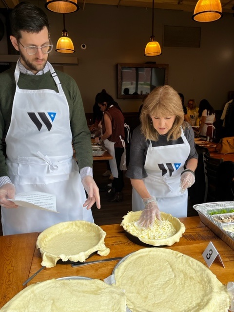 a man and a woman in a kitchen