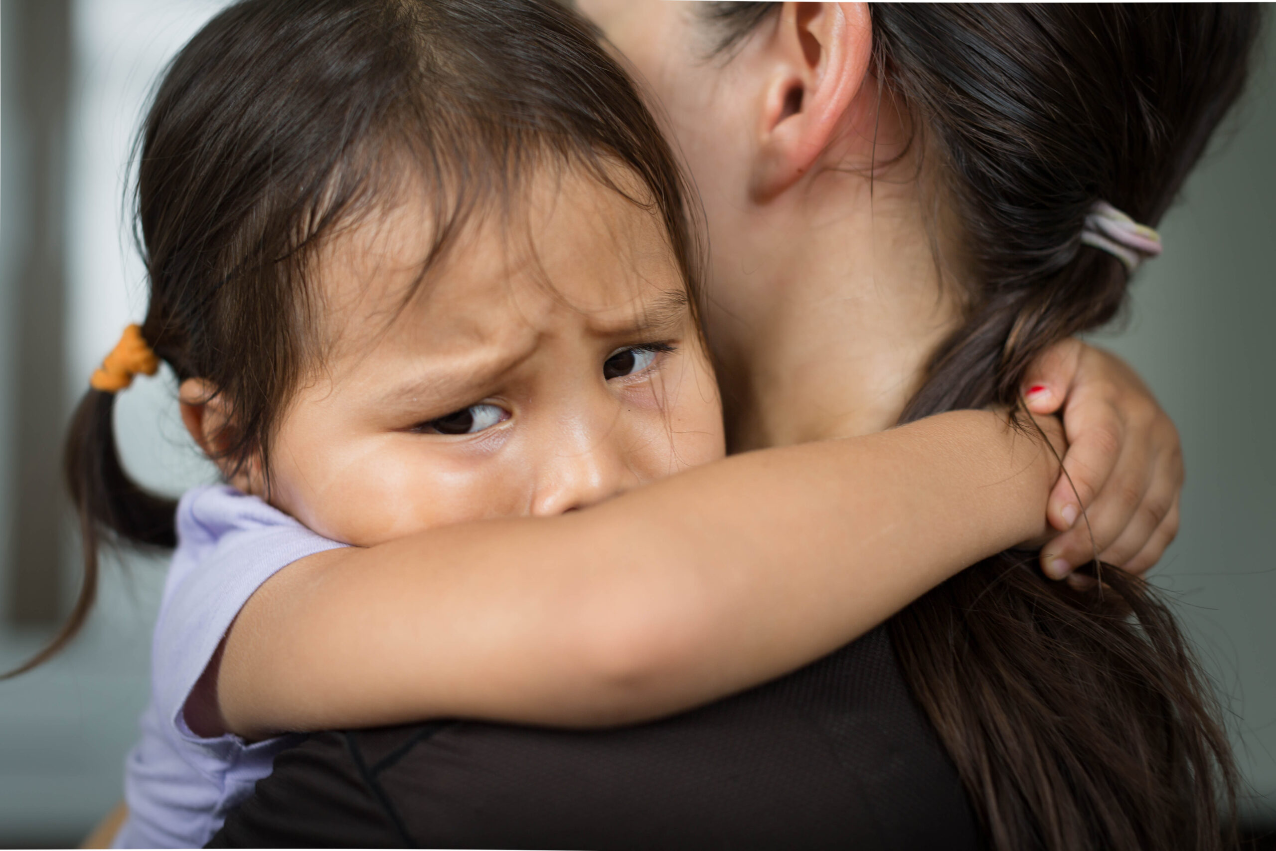 a person holding a child