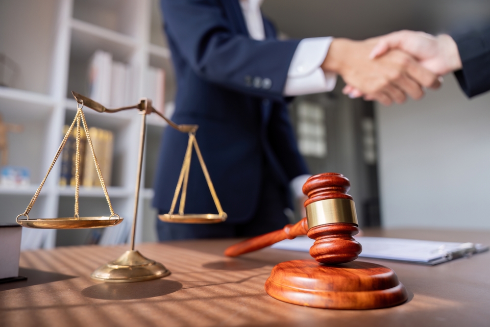 Stressed driver talks with legal advisor, getting support and guidance after a car accident claim.