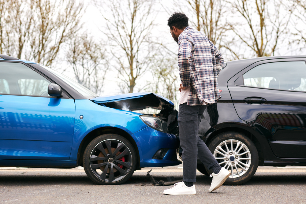 Driver confronts car ahead after collision, pointing out fault, showing tension after unexpected accident twist.