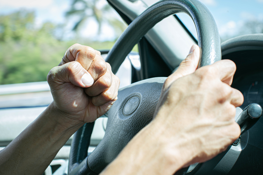 Driver tailgates, honks aggressively, and swerves at another car—three common examples of road rage.