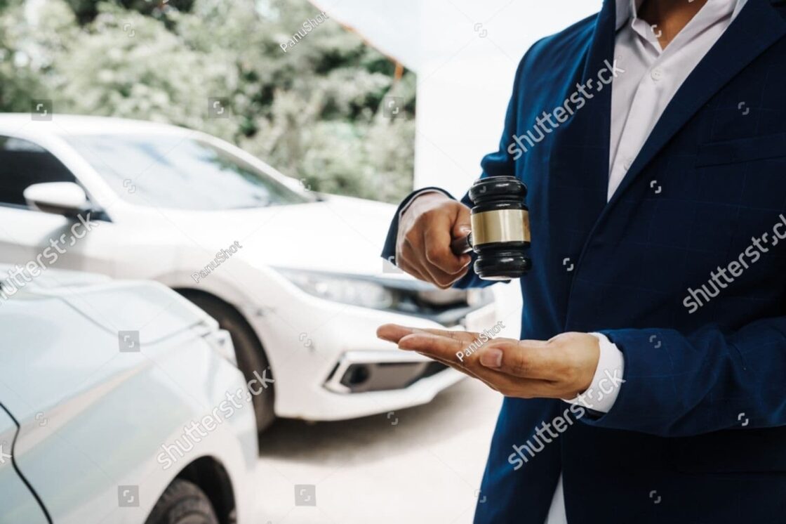 Lawyer with gavel discuss traffic violation details—focusing on citations, liability, and negligence laws.