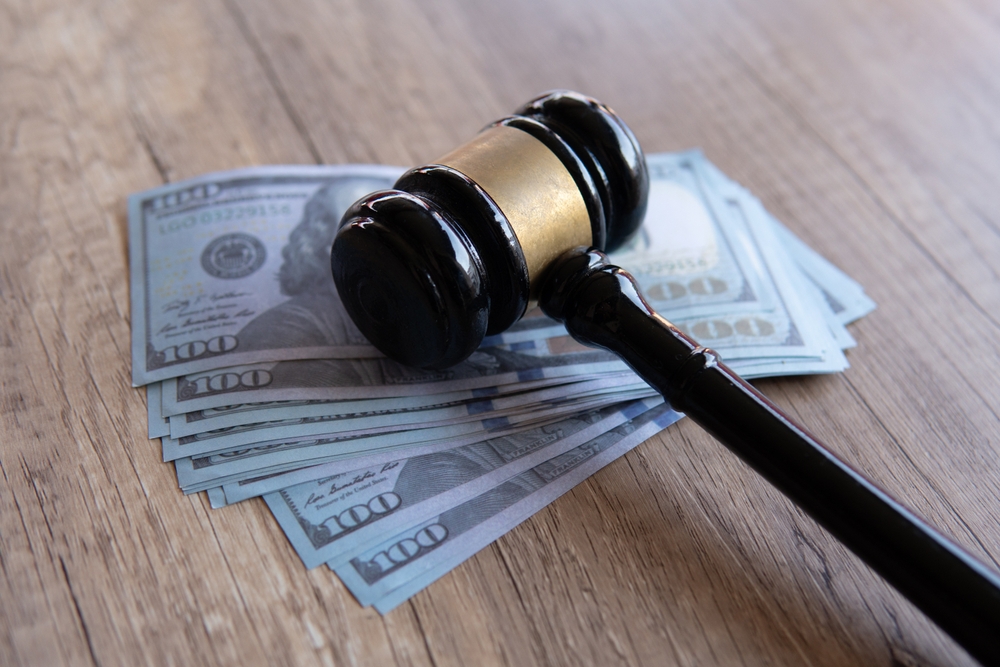 Closeup image of gavel and money. 
