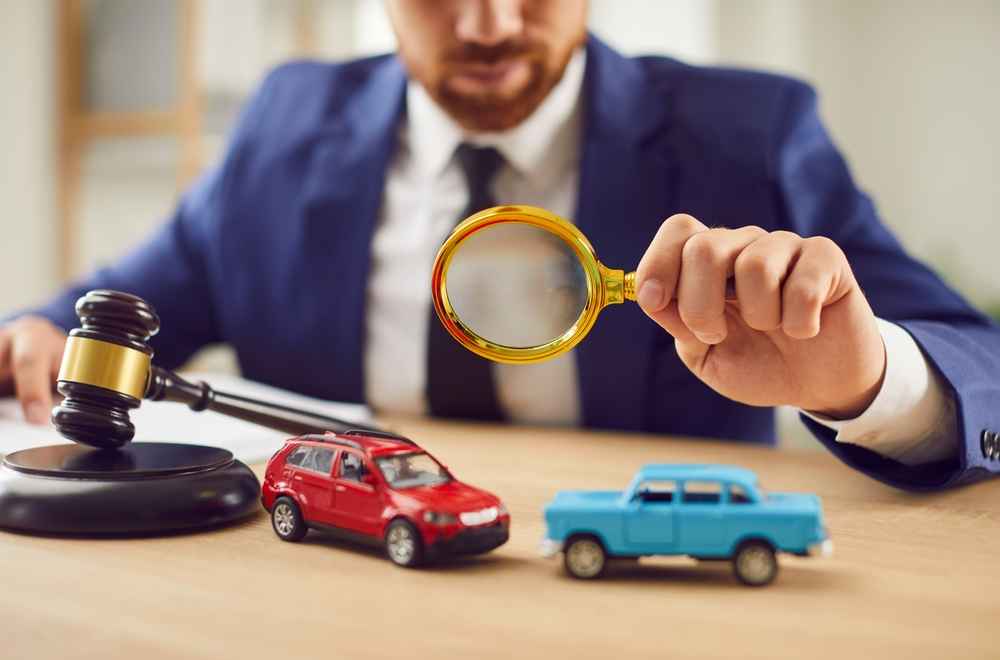 A lawyer is investigating car accident with toy cars