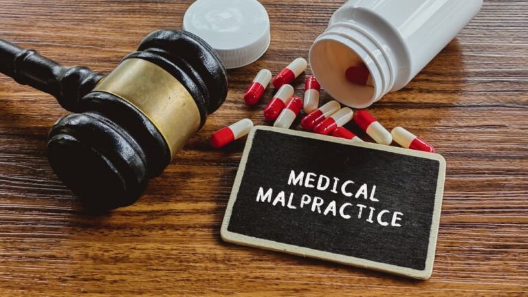 Medical Malpractice Legal Action: Gavel, Pills, and Medicine Bottle