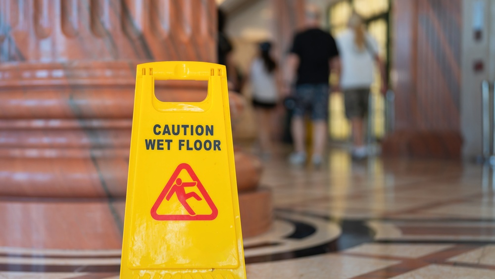 Caution: Wet Floor Sign placed in government building atrium